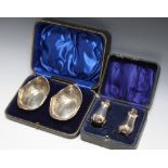 A CASED SET OF HALLMARKED SILVER PIERCED DISHES - SHEFFIELD 1915, together with a cased pair of