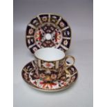 A ROYAL CROWN DERBY TEA CUP AND SAUCER, together with a shallow bowl / dish (3)