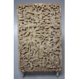 A 19TH CENTURY CARVED CANTON IVORY CARD CASE, typically decorated with figures and pavilions, 11.5