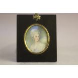 (XIX). British school oval portrait miniature on ivory of a young woman in white dress, landscape