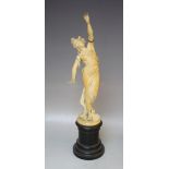 A 19TH CENTURY CARVED IVORY STUDY OF A CLASSICAL MAIDEN, on an ebonised socle plinth, overall H 42
