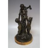 A 19TH CENTURY BRONZE FIGURATIVE STUDY OF THREE CHERUBS ON AND AROUND A TREE STUMP, raised on a