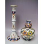 A 20TH CENTURY FRENCH FAIENCE POTTERY CANDLESTICK, H 37 cm, together with a Poly Delft double