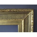 A 19TH CENTURY DECORATIVE GOLD FRAME WITH GOLD SLIP, frame W 12 cm, frame rebate 69 x 59 cm, slip