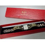 A BOXED KENNETH JAY LANE ANIMAL PRINT WATCH, silver tone with crystal embellishment