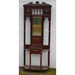 A LARGE EDWARDIAN MAHOGANY MIRRORED HALL STAND, with brass fittings, single small drawer, the base