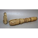 AN EASTERN CARVED IVORY HANDLE / PULL?, with incised decoration around the turned body, with cut-