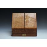 AN OAK SLOPE FRONTED STATIONARY BOX, W 37 cm