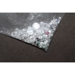 A BAG OF LOOSE MIXED STONES, including cubic zirconia, ruby, sapphire and emerald 73.55ct