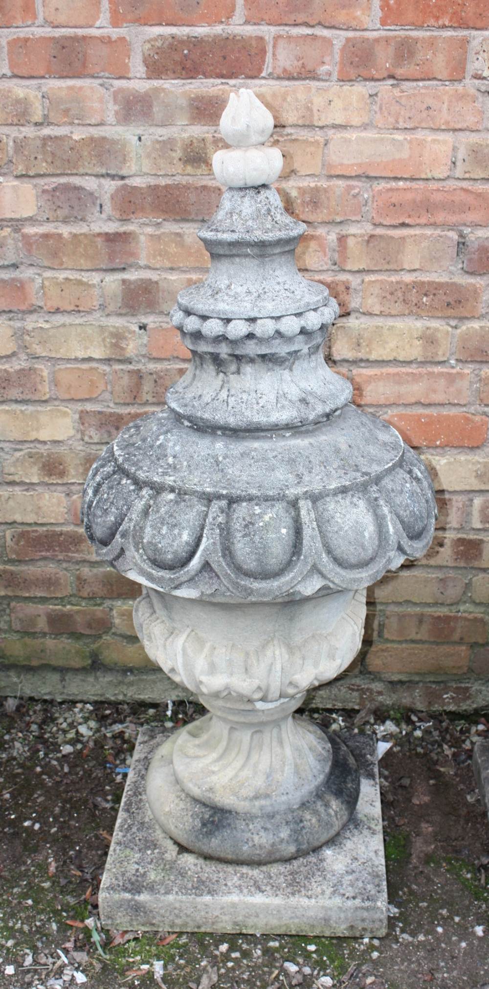 A PAIR OF LARGE STONE PEDESTAL URNS, supported on a squared foot leading to a solid swirling base, - Image 2 of 3