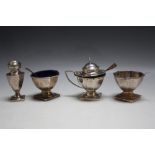 A HALLMARKED SILVER FOUR PIECE CRUET SET - BIRMINGHAM 1917, consisting of mustard, two salt