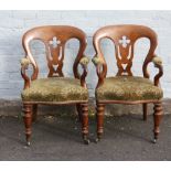 A PAIR OF 19TH CENTURY OAK ARMCHAIRS, having pierced splat back, scroll arms with upholstered