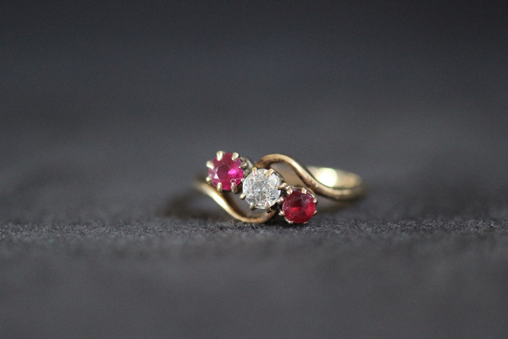 AN 18CT GOLD THREE STONE RUBY AND DIAMOND RING, approx weight 3.7g, ring size P 1/2