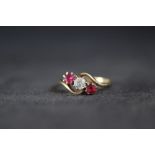 AN 18CT GOLD THREE STONE RUBY AND DIAMOND RING, approx weight 3.7g, ring size P 1/2
