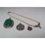 A LARGE OVAL MALACHITE PENDANT IN WHITE METAL MOUNT, indistinct marks to the bail, H 6 cm,