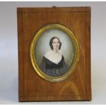 A. HUGE (XIX). An oval portrait miniature on ivory of a young lady in black dress, signed and