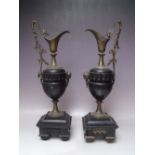A PAIR OF NEOCLASSICAL STYLE MANTLE URNS / GARNITURES, the metal mounts depicting a mythical bird to
