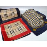 A VINTAGE BURBERRY SCARF, 46 x 46 cm, together with an Aquascutum scarf, 146 x 25 cm (2)