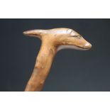 A WALKING STICK WITH A CARVED DOG HEAD HANDLE, L 89 cm