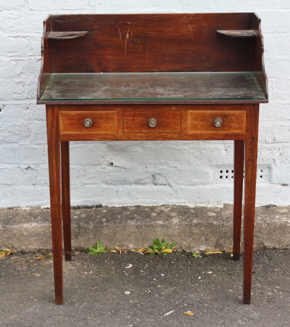 AN ANTIQUE MAHOGANY INLAID SMALL WASHSTAND, the tray top above two small drawers and a central dummy