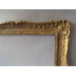 A LATE 19TH CENTURY / EARLY 20TH CENTURY GOLD SWEPT FRAME, frame W 7 cm, frame rebate 92 x 61 cm