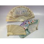 AN ANTIQUE CARVED BONE / IVORY HAND PAINTED FOLDING FAN, L 19 cm, together with a smaller plain