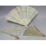 TWO ANTIQUE CARVED BONE / IVORY BRISE FANS FOR RESTORATION, longest L 26 cm, together with a plain