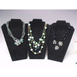 A SELECTION OF BUTLER AND WILSON FASHION NECKLACES, to include a gold tone triple strand aurora