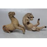TWO UNUSUAL MINIATURE CRACKLE GLAZE TANG HORSES, one modelled seated with hooves flailing, the other