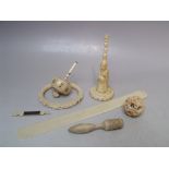 AN ANTIQUE IVORY SPINNING DICE, together with a collection of ivory items to include a carved