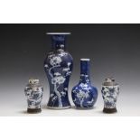 FOUR PIECES OF ORIENTAL CHINA, consisting of a small pair of baluster vases, a specimen 'Prunus'