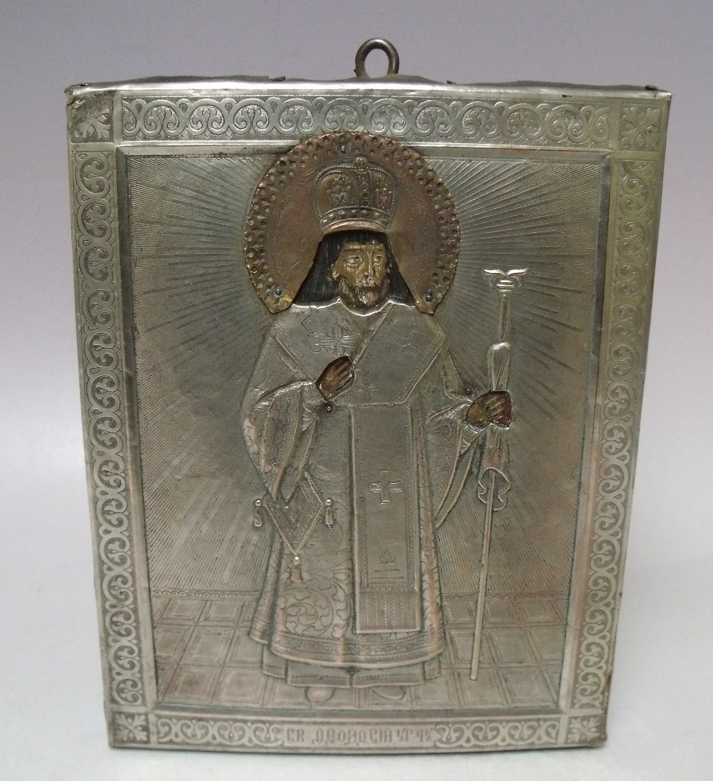 (XIX). A religious icon on panel with exposed head and hands and white metal oklad with acrylic
