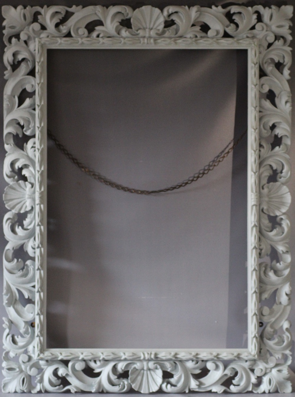 A LATE 18TH CENTURY CARVED LIMEWOOD FLORENTINE PICTURE FRAME, frame W 16 cm, frame rebate 111 x 75