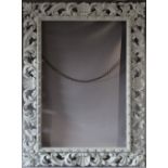 A LATE 18TH CENTURY CARVED LIMEWOOD FLORENTINE PICTURE FRAME, frame W 16 cm, frame rebate 111 x 75