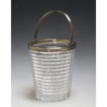 A HALLMARKED SILVER AND EDINBURGH CRYSTAL SWING HANDLED ICE BUCKET BY GOLDSMITHS AND SILVERSMITHS CO