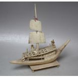 A LATE 19TH / EARLY 20TH CENTURY IVORY CARVED JUNK WITH FISHERMAN, raised on a rectangular plinth