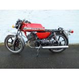 A 1982 YAMAHA RD200 MOTORCYCLE 'BWD 354Y', having red coachwork and chrome mudguards, partially