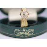 ROLEX - A LADIES 18 CARAT GOLD WRIST WATCH, in heart shaped green Rolex box with original