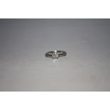 A PLATINUM DIAMOND SOLITAIRE RING, the brilliant cut diamond being of an estimated half a carat,