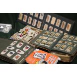 A LARGE QUANTITY OF VINTAGE CIGARETTE CARDS BOTH LOOSE AND IN ALBUMS