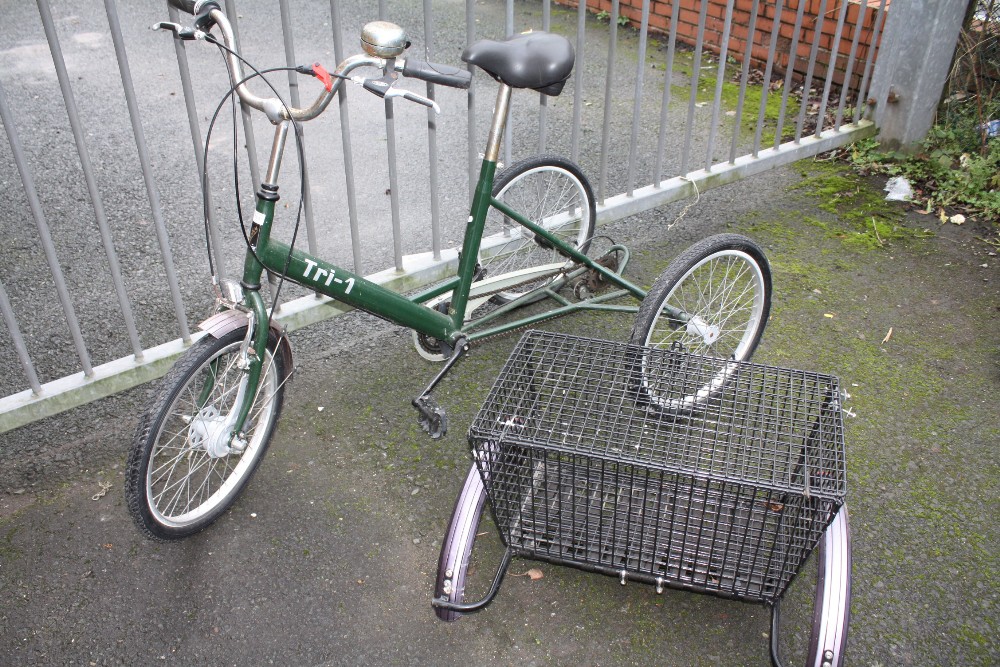 A PASHLEY TRICYCLE WITH BASKET ATTACHMENT