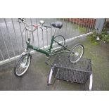 A PASHLEY TRICYCLE WITH BASKET ATTACHMENT