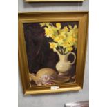 A GILT FRAMED OIL ON BOARD OF A STILL LIFE STUDY OF DAFFODILS IN A JUG, MARKED LEO FISON BATES