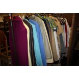 A RAIL OF VINTAGE AND MODERN LADIES CLOTHING