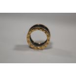 A BVLGARI 18CT ROSE GOLD FOUR BAND RING, the ring with black sprung ceramic spiral design to the