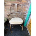 AN ERCOL LARGE HOOP BACK WINDSOR ARMCHAIR