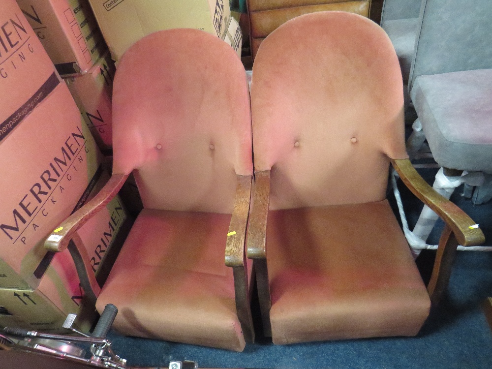 A PAIR OF VINTAGE OAK FRAMED UPHOLSTERED ARMCHAIRS