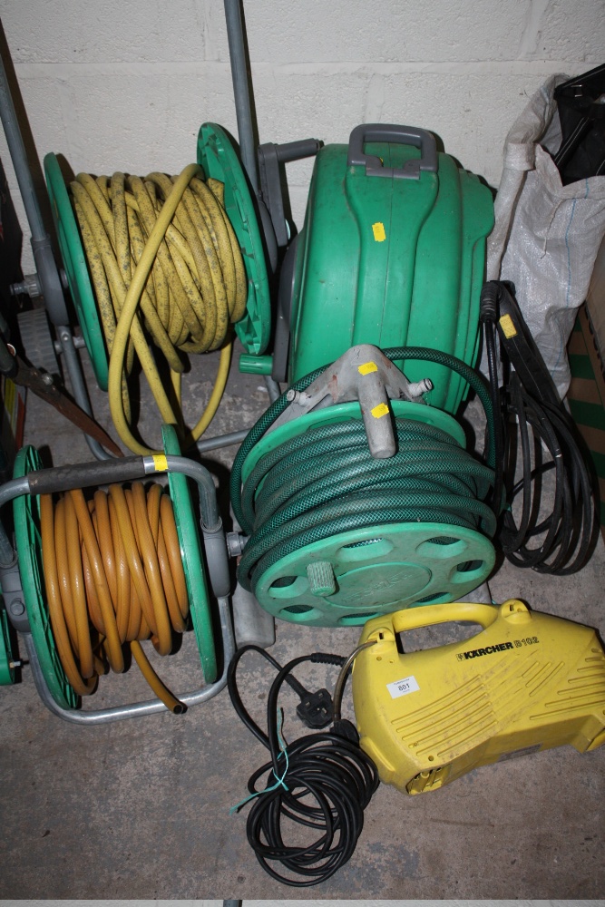 A KARCHER PRESSURE WASHER PLUS HOSE REELS ETC