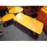 AN ERCOL STYLE LOW COFFEE TABLE, L-105 CM AND TWO 'PEBBLES' OCCASIONAL TABLES (3)