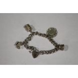 A HALLMARKED SILVER CHARM BRACELET